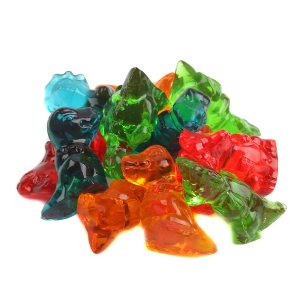 Vibrant, assorted 3D gummy dinosaurs in red cherry, green apple, orange, and blue raspberry colors.