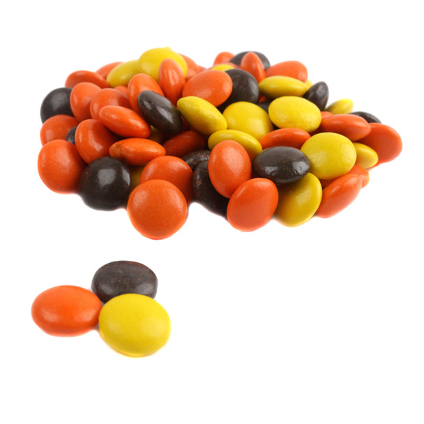 Reese's Pieces, small button-sized peanut butter candy. Yellow, orange, and brown, approx 500 pieces per pound.