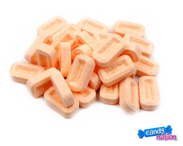 Bulk Pez orange candy, loose, with over 600 bright orange pieces per pound, offering a sweet and tangy flavor.
