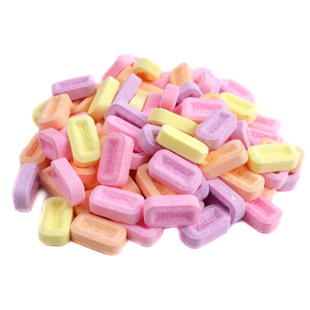 Bulk Pez fruit candies, assorted watermelon, blue raspberry, grape, orange, apple, cherry, pineapple, many loose pieces.