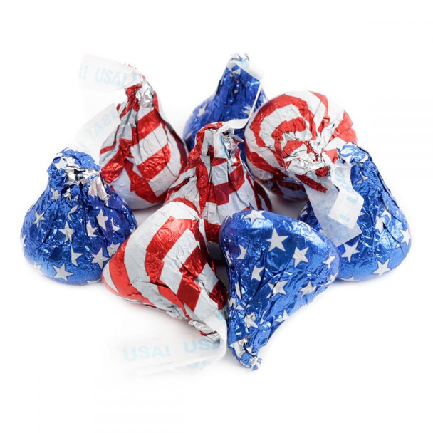 Hershey Kisses Patriotic Foils, individually wrapped in red, white, and blue stars and stripes, delicious milk chocolate candy.
