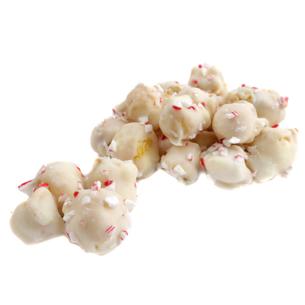 White confectionery coated popcorn, liberally sprinkled with vibrant red crushed peppermint candy cane pieces.