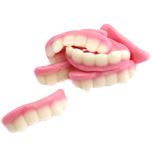 Vidal Gummy Teeth, lifelike pink strawberry flavor, approx 90 pieces per pound, perfect for Halloween candy buffets.