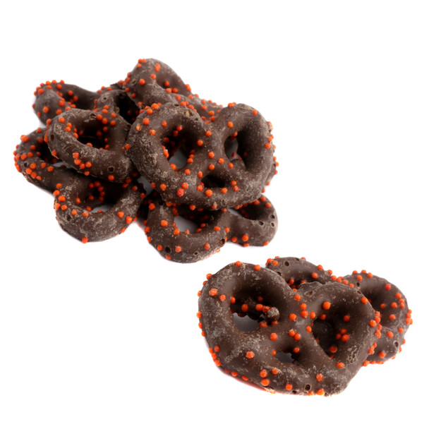 Milk chocolate mini pretzels generously sprinkled with vibrant orange nonpareils, a festive fall treat, approx 90/lb.