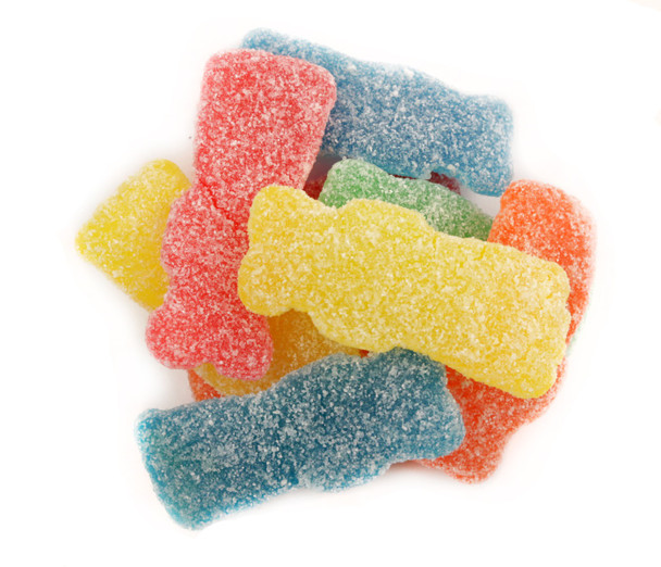 Four 1.7lb bags of colorful unwrapped Sour Patch Big Kids, larger red, green, orange, yellow candies visible.