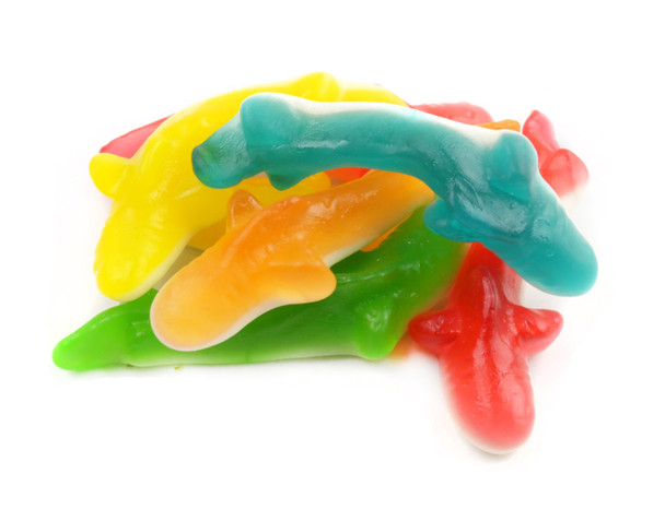 Assorted mini gummy sharks. Multi-colored, soft, fruity candy. 6/4.4lb bulk case, approx 60 sharks per pound.