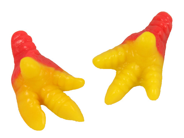 Hundreds of pink and yellow Gummy Chicken Feet candies in a large 4.4lb bulk bag.