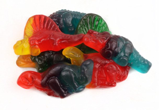 Gummy Dinosaurs, 12/2.2lb case. Bright red, green, yellow dino shapes like brontosaurus, stegosaurus, triceratops.