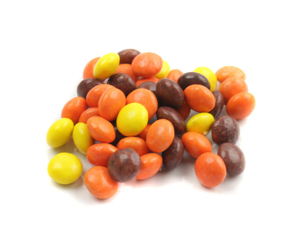 25lb bulk tiny Reese's Pieces candy. Orange, yellow, brown peanut butter candies with crunchy shells, ideal for baking.