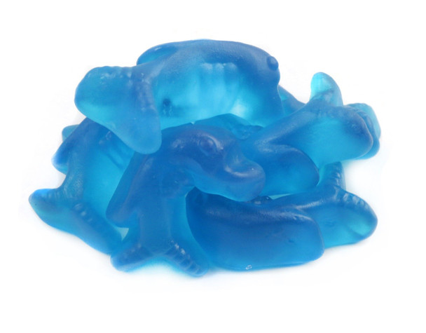 Three 2.2 LB bags of realistic blue blueberry gummy dolphins, each 2.5 inches long.