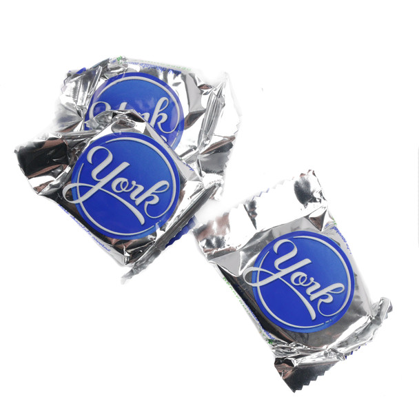 Mini York Peppermint Patties, dark chocolate, mint, individually wrapped in silver foil, approximately 40 per pound.