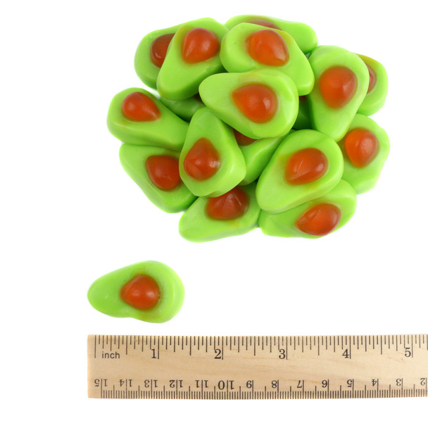 Oversized, two-tone green gummy avocados with playful pit details and tropical mango flavor candy.