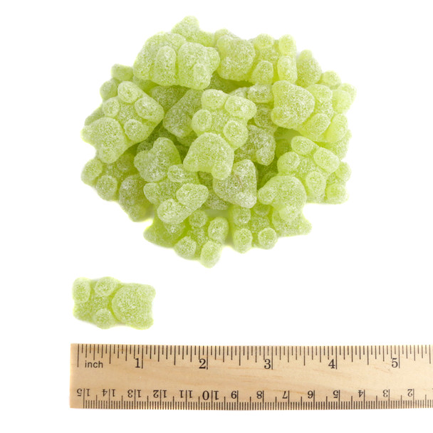 Pile of green Gin & Tonic Gummy Bears, chewy, non-alcoholic, with bright citrus and botanical cocktail flavors.