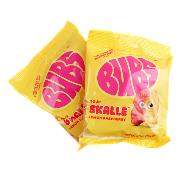 Vibrant yellow and red Bubs Sour Lemon Raspberry Skull candies, skull-shaped, coated in sparkling sour sugar. Chewy, vegan.