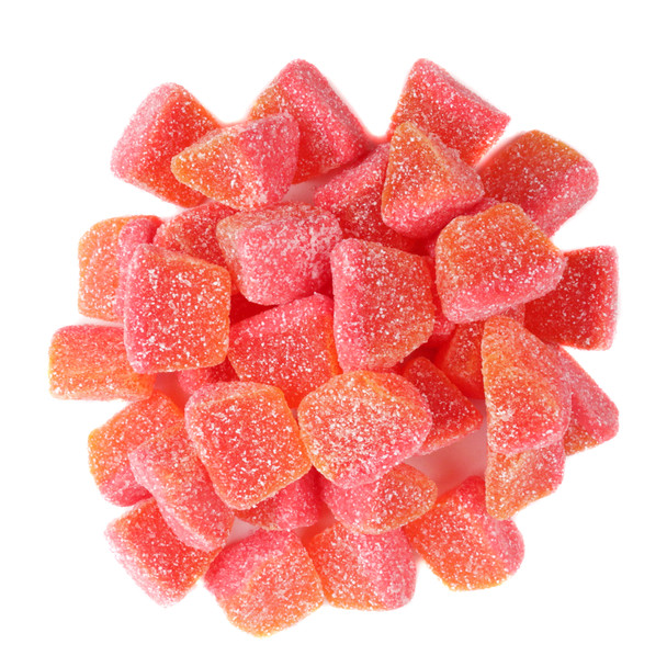 Fini Spicy Mango Gummy Slices, vibrant orange, sugar-dusted. Soft, chewy, sweet, spicy, tangy flavor. Many pieces.