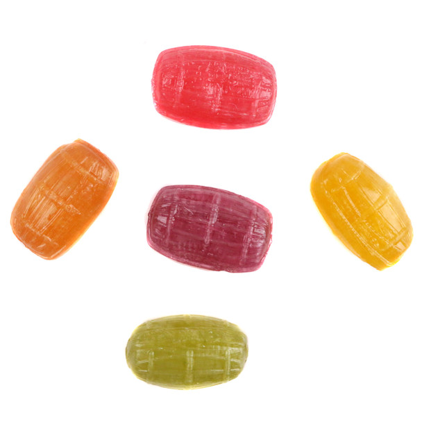 Close-up of unwrapped green apple, cherry, and lemon hard candy barrels showing their smooth translucent texture and classic ridged barrel shape