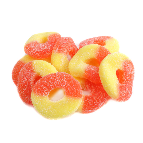 Vibrant orange and yellow gummy Peach Rings candy with sour sugar coating, approx. 60 rings per pound, USA made