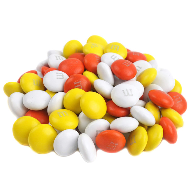Bulk autumn-themed M&M milk chocolate candies.