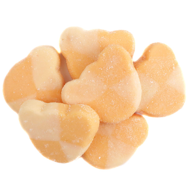 Swedish style sour mango gummy bears in a bulk pile showing pastel orange candy bear head