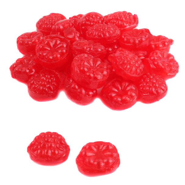 Unwrapped Cavalier red raspberry hard candy showing its polished finish and bright red color.