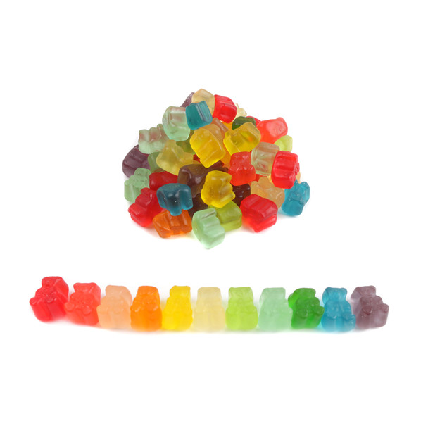 Assorted 12 flavor mini gummy bear cubs, vibrant red, orange, yellow, green, purple colors in a bulk pile.