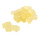Pile of bright yellow pineapple gummy bears, approx. 145 per pound, 1-inch long. Sweet tropical candy.