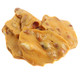 Bulk pile of crunchy peanut brittle broken into large, roasted peanut-filled candy pieces.