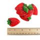 Bright red, green, strawberry-shaped gummy candies with creamy marshmallow bottoms, approximately 45 pieces per pound.