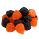 A pile of vibrant orange Juju Pumpkins, chewy candy with orange & grape flavors, approx 45 per pound for Halloween.
