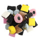 Gerrit Verburg Licorice Allsorts, English black licorice candy with pink, blue, yellow, black, white pieces, assorted shapes, textures.