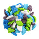 An assortment of unwrapped Concord Spaced Out pressed dextrose candies in purple, blues, and white scattered across a white background