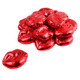 Bright red foil wrapped miniature chocolate lips, many pieces of milk chocolate candy, perfect for Valentine's Day.