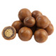 Pile of smooth, tan, round, double-dipped peanut butter malt balls candy.