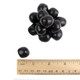Pile of bold black Black Cherry Chewy Sour Balls, tangy sour cherry flavor, soft centers, hard candy shells.