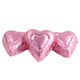 Pink mini milk chocolate hearts, individually foil-wrapped. Approx 55 hearts per pound, pastel pink. Madelaine Chocolate.