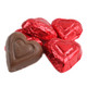 Red mini milk chocolate hearts, individually wrapped in bright red foil, approx. 55 per pound, ideal Valentine's candy.