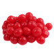 Pile of bright red Sunrise Cherry Sours, chewy bite-sized candies with a sour cherry jelly center, tangy candy shell.