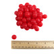 Vibrant red, bite-sized Sunrise Cherry Sours candy, sour cherry flavored with jelly centers.