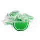 Green sour apple jelly fruit slices, individually wrapped in clear cellophane, sugar-drenched, approx 32 per pound.