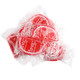Red and white strawberry jelly fruit slices, sugar-drenched, individually wrapped in clear cellophane.