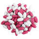 Good and Plenty black licorice candy, vibrant pink and white candy shells, chewy classic.