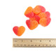 Orange-pink peach gummy hearts, heart-shaped, approximately 80 pieces per pound, with a juicy peach flavor.