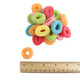 Rainbow neon Sour Gummy Rings with shimmering sour sugar coating, fruity flavors. Approximately 53 rings per pound.
