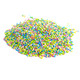 Mixed pastel blue, green, lavender, pink, white nonpareil sprinkles. Colorful Easter candy decorations, dessert toppings.