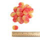 Orange, yellow, bite-sized gummy peaches coated in sparkling sugar crystals, approx 75 per pound.