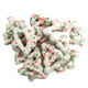 Christmas tree-shaped pretzels, white yogurt coated, sprinkled with festive red and green sugar for the holidays.
