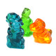 Assorted 3D Gummy Dinosaurs, red cherry, green apple, orange, blue raspberry, colorful candy buffet, kid-friendly.