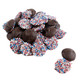Patriotic dark chocolate nonpareils with red, white, and blue sprinkles. Rich dark chocolate discs, perfect for 4th of July.