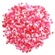 Mini Valentine heart shape sprinkles, red, white, and pink, perfect for decorating cupcakes and desserts.
