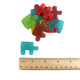 Vibrant red, green, blue, yellow, purple gummy puzzle pieces, delicious cherry, blueberry, apple, lemon, grape flavors.